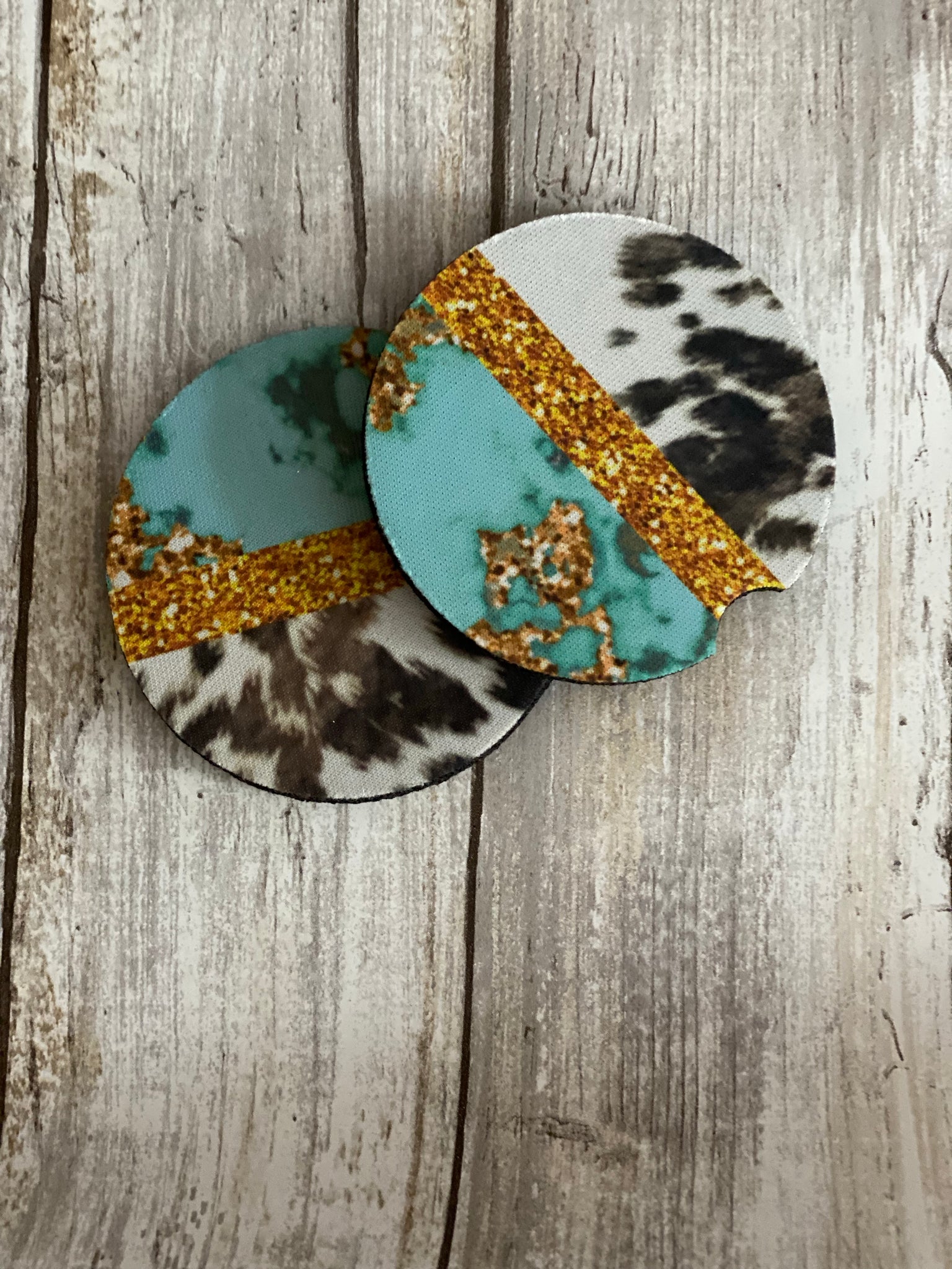 Turquoise cow print car coasters